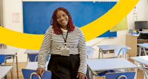 woman smiling in front of class