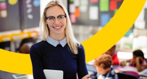 happy teacher in classroom