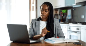 woman in a business suit working at her computer