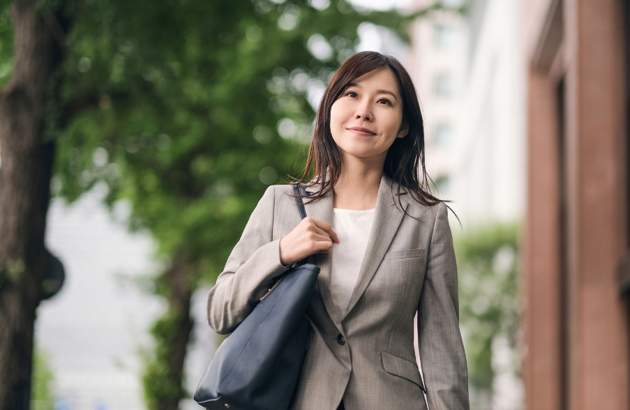 business woman walking and smiling