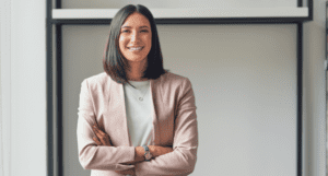 woman standing in front of classroom smiling