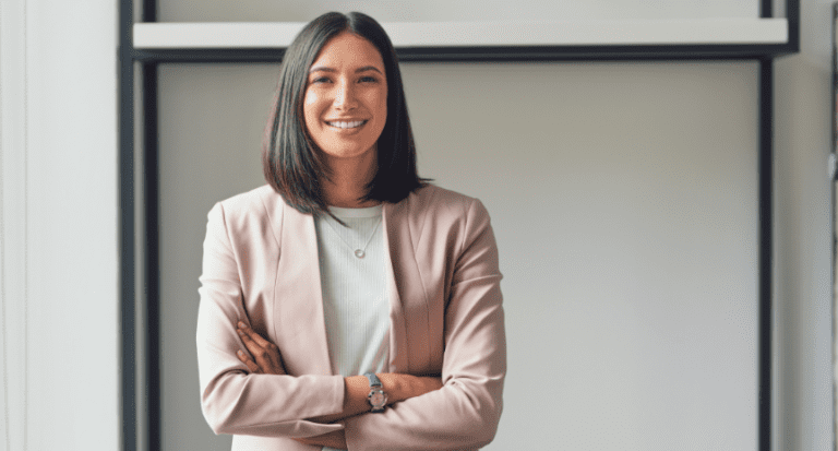 woman standing in front of classroom smiling