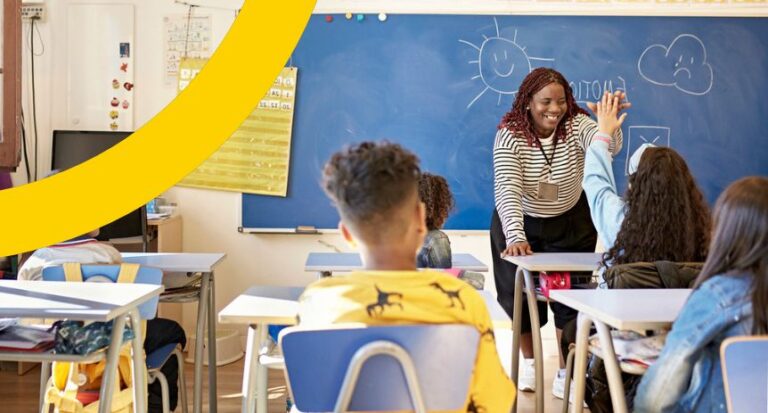 image of woman high fiving a student in class