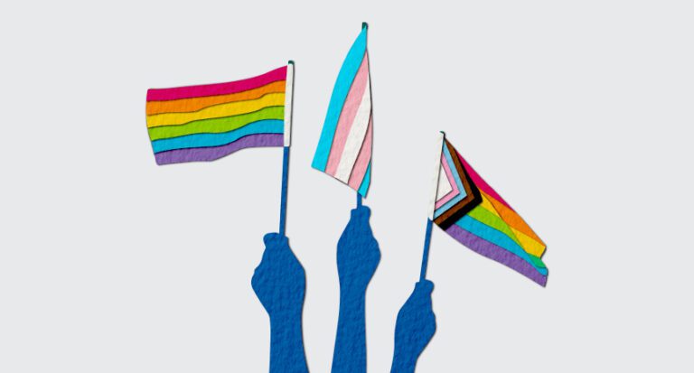 illustration of hands holding various pride month flags
