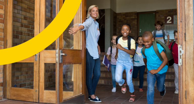 blonde teacher letting students out of school
