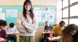 New teacher in classroom with students.
