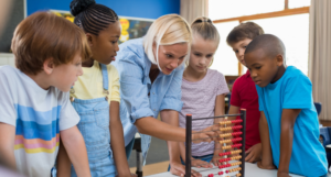 blonde teacher demonstrating a game with students